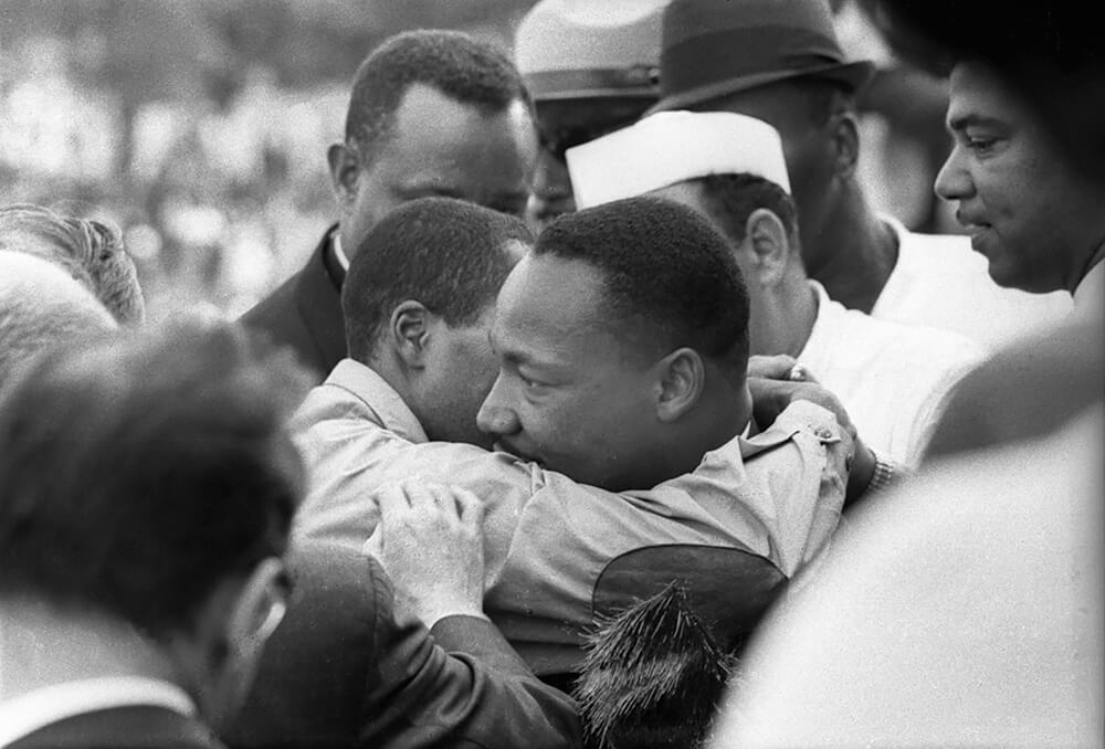 MLK, Jr being congratulated after his speech. August 28, 1963.<p>© Dan Budnik</p>