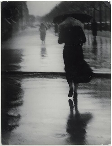 Passerby in the Rain (1935)<p>Courtesy Vintage Works, Ltd / © George Brassaï</p>