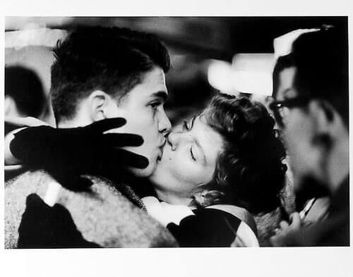Couple kissing, man looking away, New Year’s Eve mid 1950s<p>Courtesy Trunk Archive / © Jay Maisel</p>