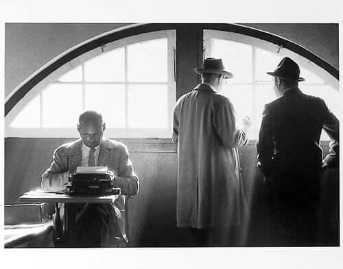 Sprits writers, one at typewriter mid 1950s<p>Courtesy Trunk Archive / © Jay Maisel</p>