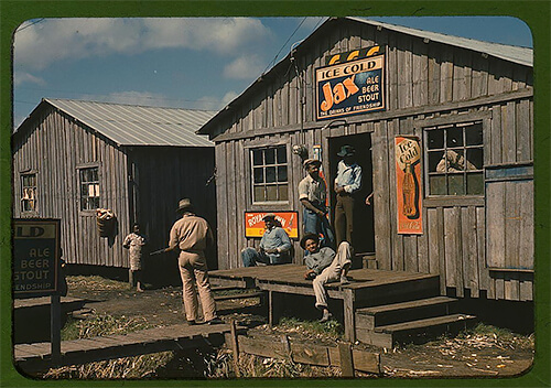 Living quarters and a ”juke joint” for migratory workers during a slack season, in Belle Glade, Florida, taken in early 1941. ©Library of Congress<p>© Marion Post Wolcott</p>