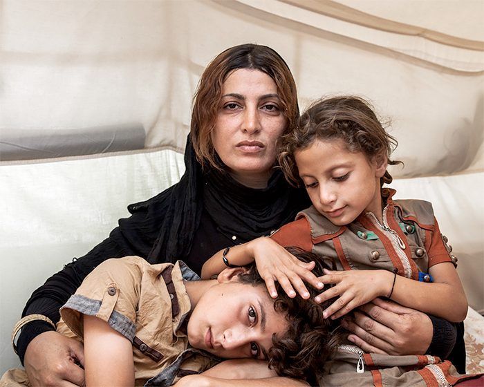 Amira and her Children by Ivor Prickett, 2014