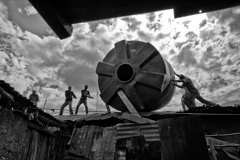 Maureen Ruddy Burkhart - Moving the 10K Liter Water Tank