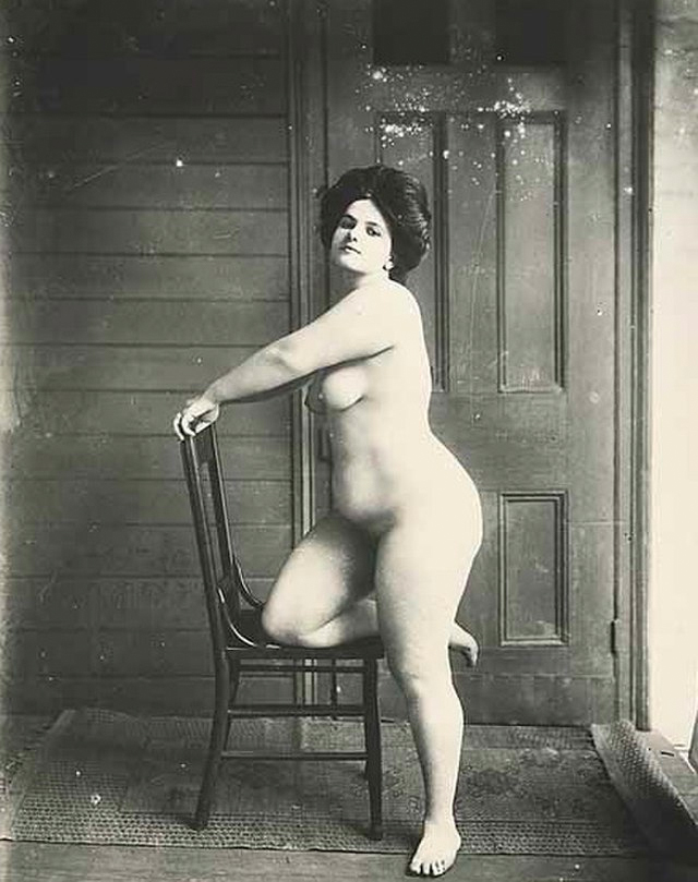 Photograph of Storyville prostitute, by E. J. Bellocq, circa 1912. Nude woman kneeling on chair.<p>© E. J. Bellocq</p>