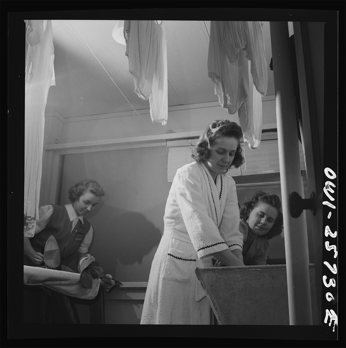 Arlington, Virginia. Washing clothes in one of the laundry rooms at Idaho Hall, Arlington Farms, a residence for women who work in the government for <p>© Esther Bubley</p>