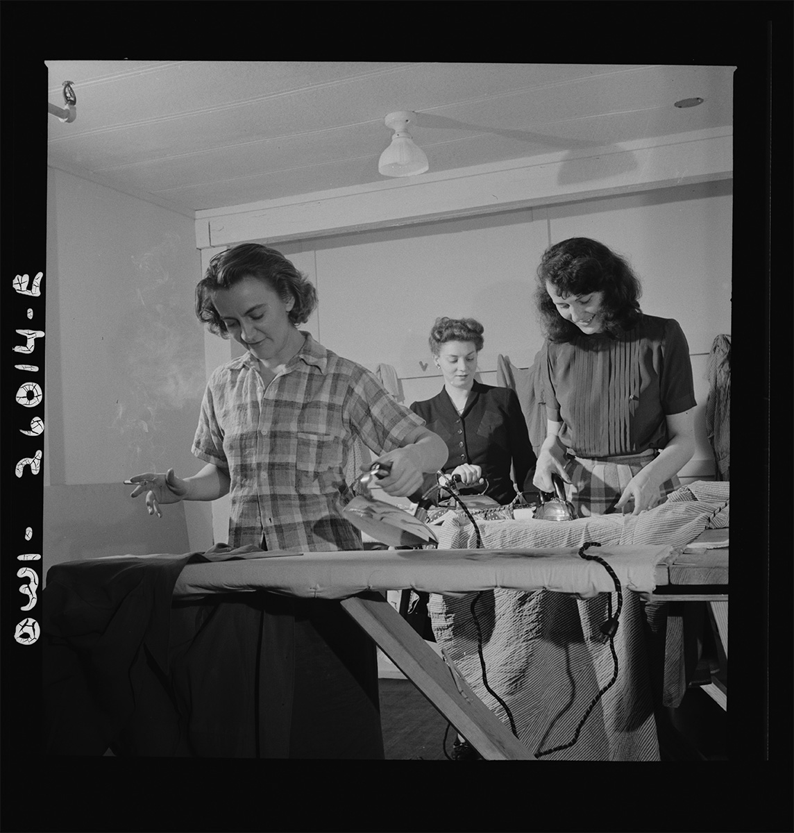 Arlington, Virginia. Ironing in one of the laundry rooms at Idaho Hall, Arlington Farms, a residence for women who work in the U.S. government for the<p>© Esther Bubley</p>