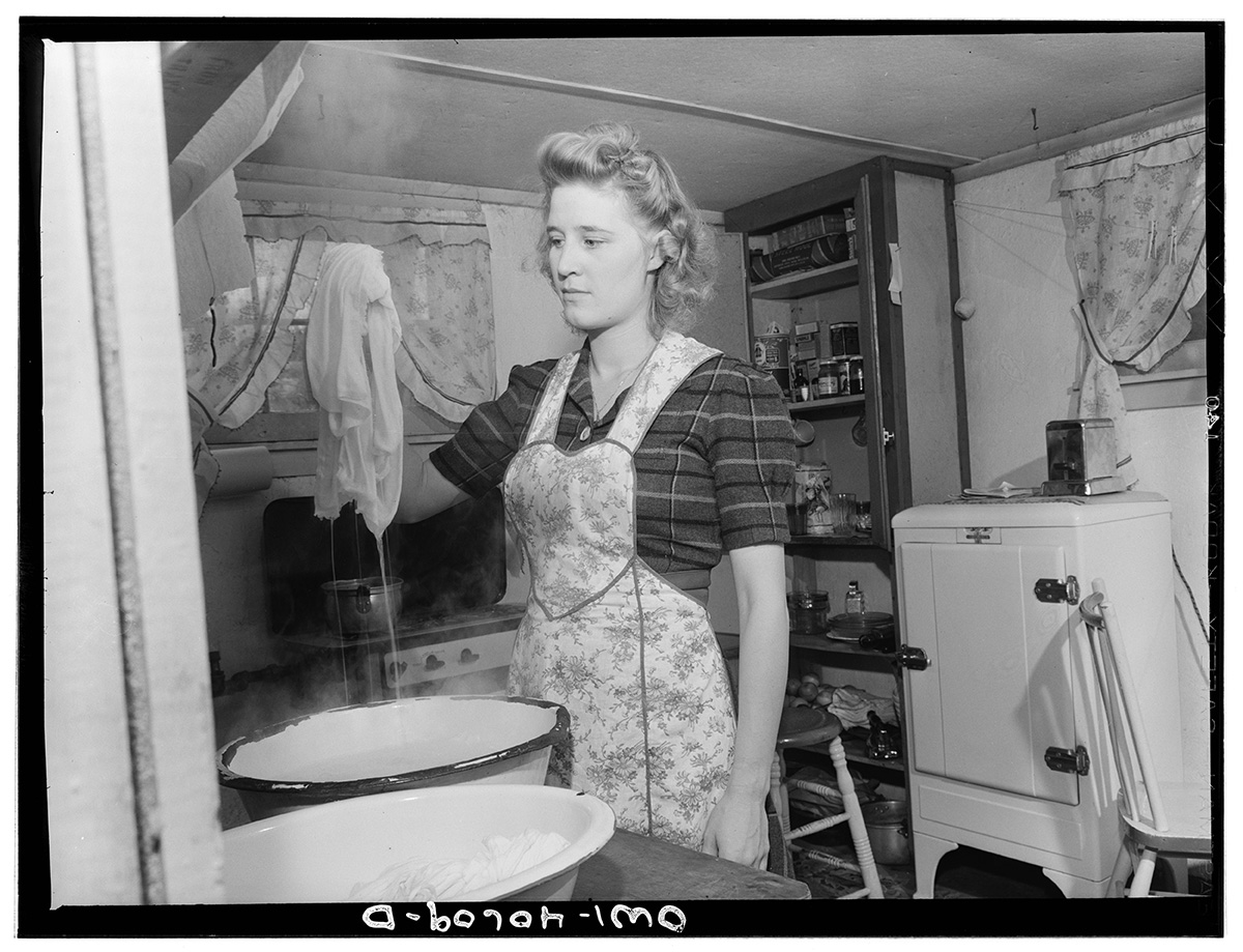 Washington, D.C. Every morning, Lynn Massman, wife of a second class petty officer who is studying in Washington, must wash clothes and diapers for he<p>© Esther Bubley</p>