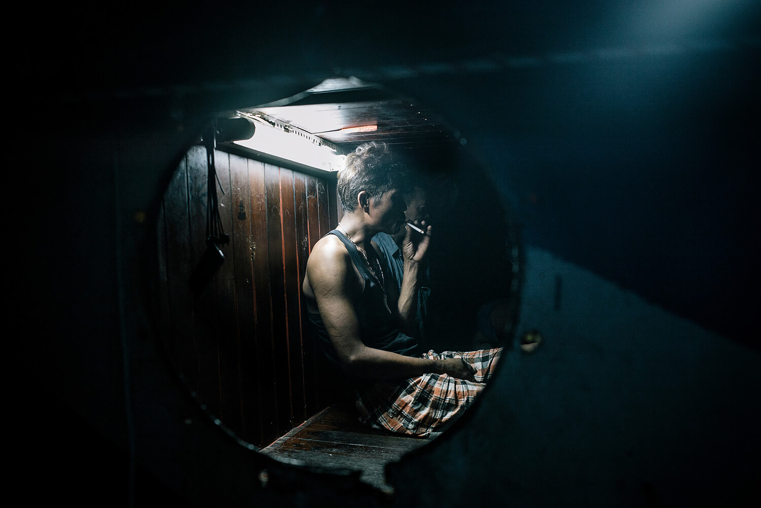 Burma: Slavery at Sea. Burmese crewman on a Thai fishing trawler coming back into port in Mahachai.<p>Courtesy Redux Pictures / © Jean-Michel Clajot</p>