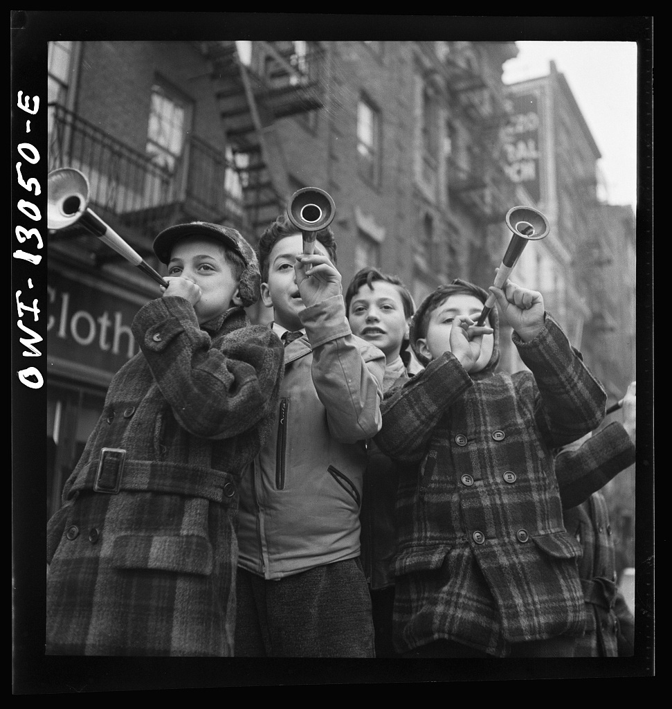 New York, New York. Blowing horns on Bleeker Street on New Year’s Day, 1 January 1943 - Library of Congress<p>© Marjory Collins</p>