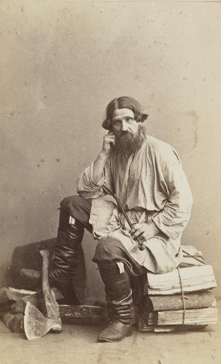 Woodcutter, sitting on bundle of logs, axe on ground beside him, holding a pipe - National Galleries of Scotland<p>© William Carrick</p>