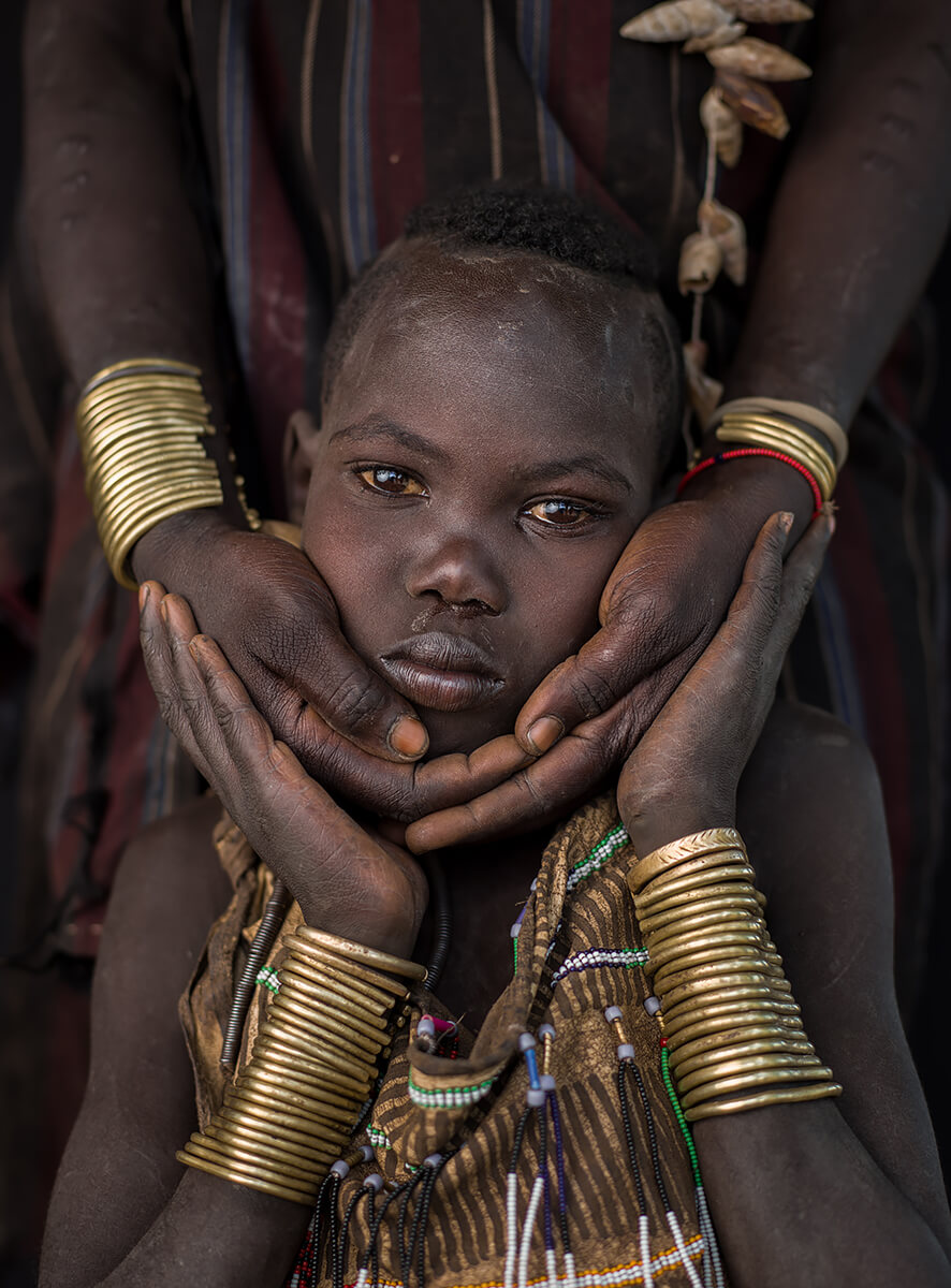 In My Mother’s Arms - Mursi Tribe<p>© Mauro De Bettio</p>