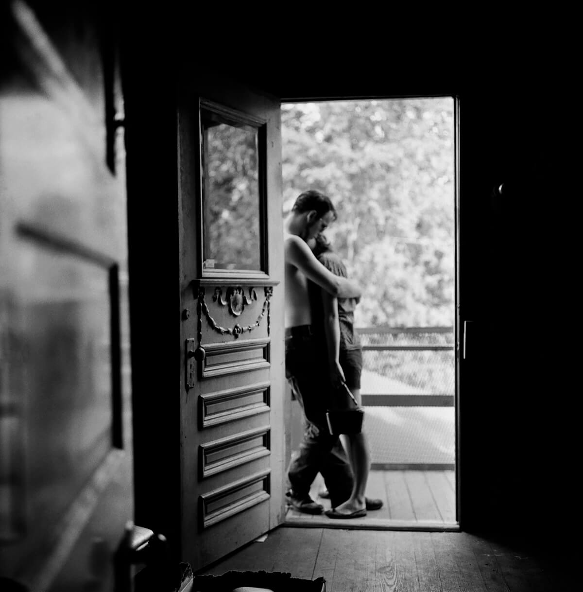 Lovers in a Doorway, Houston, TX 1958<p>© Larry Fink</p>