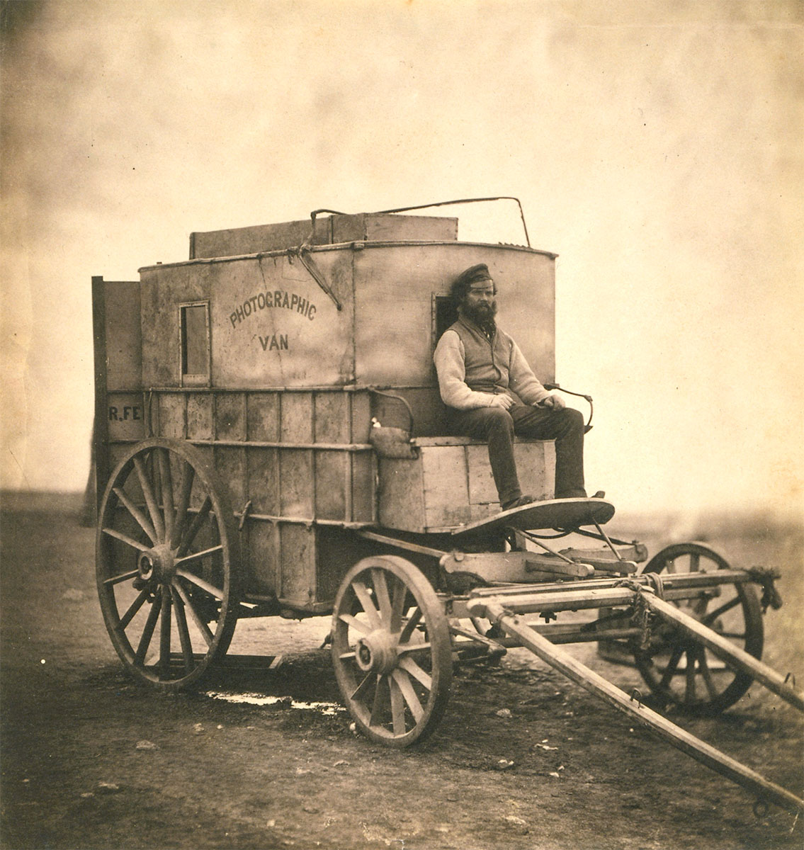 The artist’s van. Marcus Sparling, full-length portrait, seated on Roger Fenton’s photographic van, 1855 - Library of Congress<p>© Roger Fenton</p>