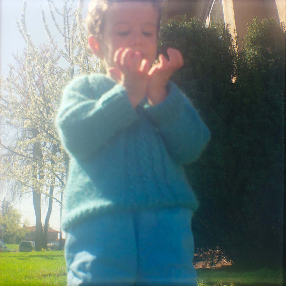 Ben Looking at Hands in the Light, 1990<p>© Carole Glauber</p>