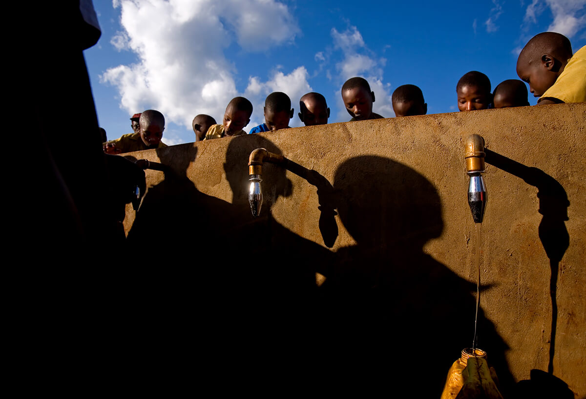 Rwandan children use their new school taps built by Nestle<p>© Georgina Goodwin</p>