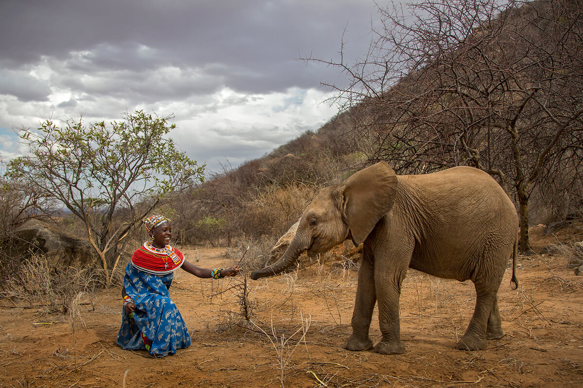 A beautiful moment between Naltwasha LeRipe and orphaned baby elephant Shaba at Reteti Elephant Sanctuary in Samburu, Kenya<p>© Georgina Goodwin</p>