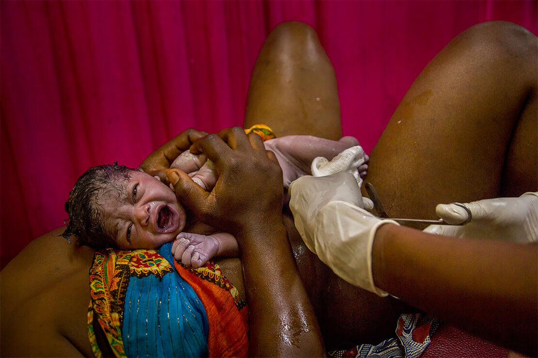 30 seconds old newborn baby Marian born to Congolese refugee Tosha Sangan, 32 in western Tanzania<p>© Georgina Goodwin</p>