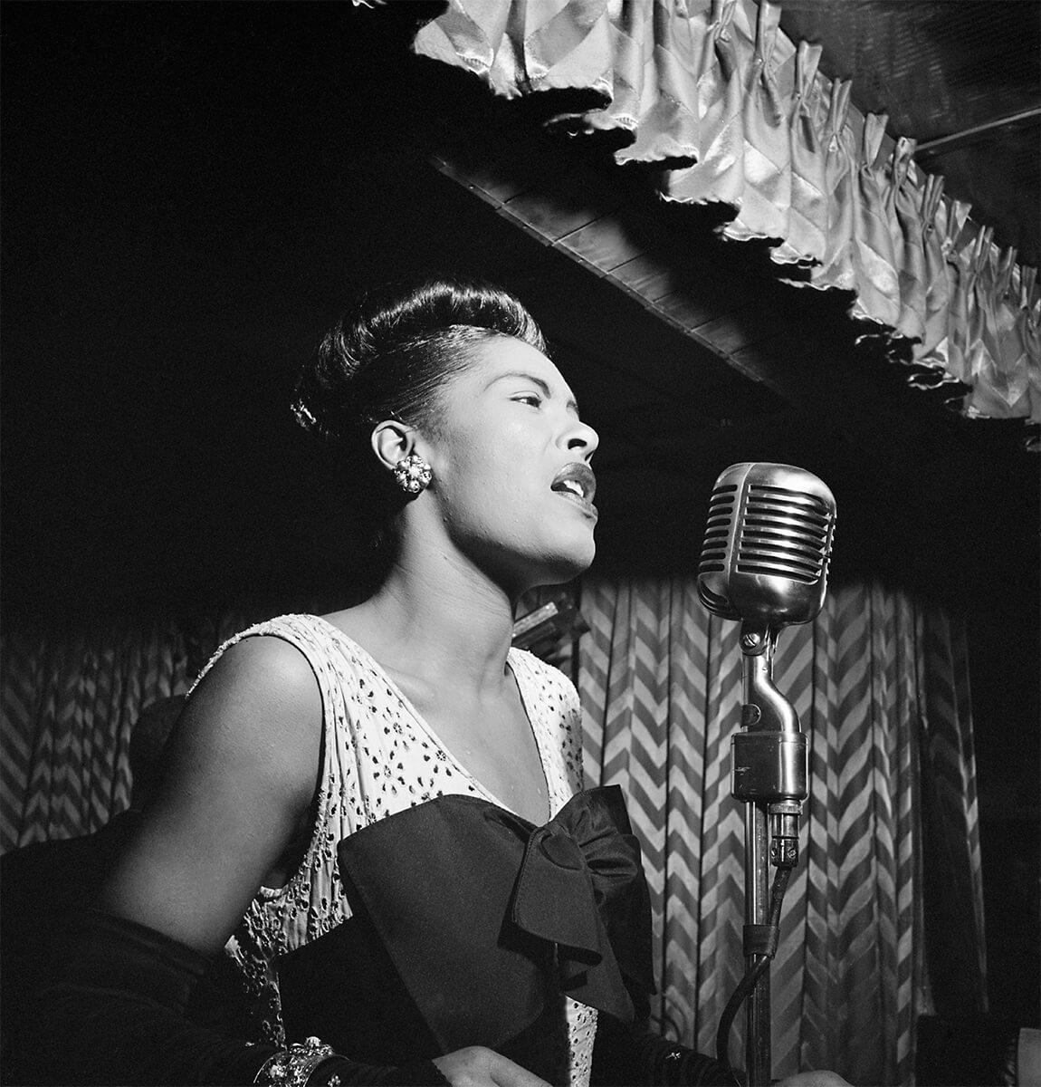 Billie Holiday at the Downbeat club, a jazz club in New York City, circa February 1947<p>© William Gottlieb</p>