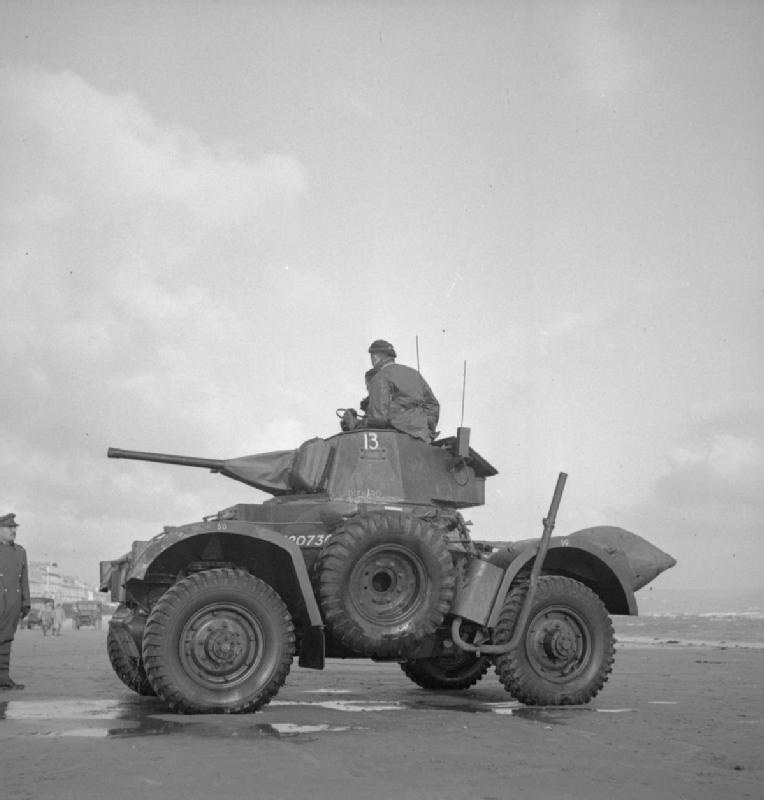 Daimler armoured car on the beach at Weymouth during landing trials, 13 December 1943<p>© Bert Hardy</p>