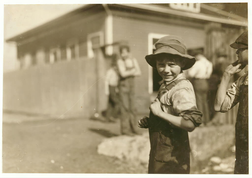 Charlie Foster has a steady job in the Merrimack Mills. Huntsville, Alabama. Lewis Hine