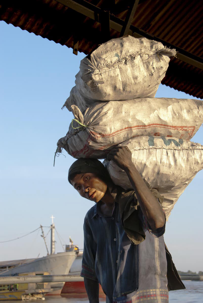 Charcoal unloading, Yangon docks<p>© Rod Harbinson</p>