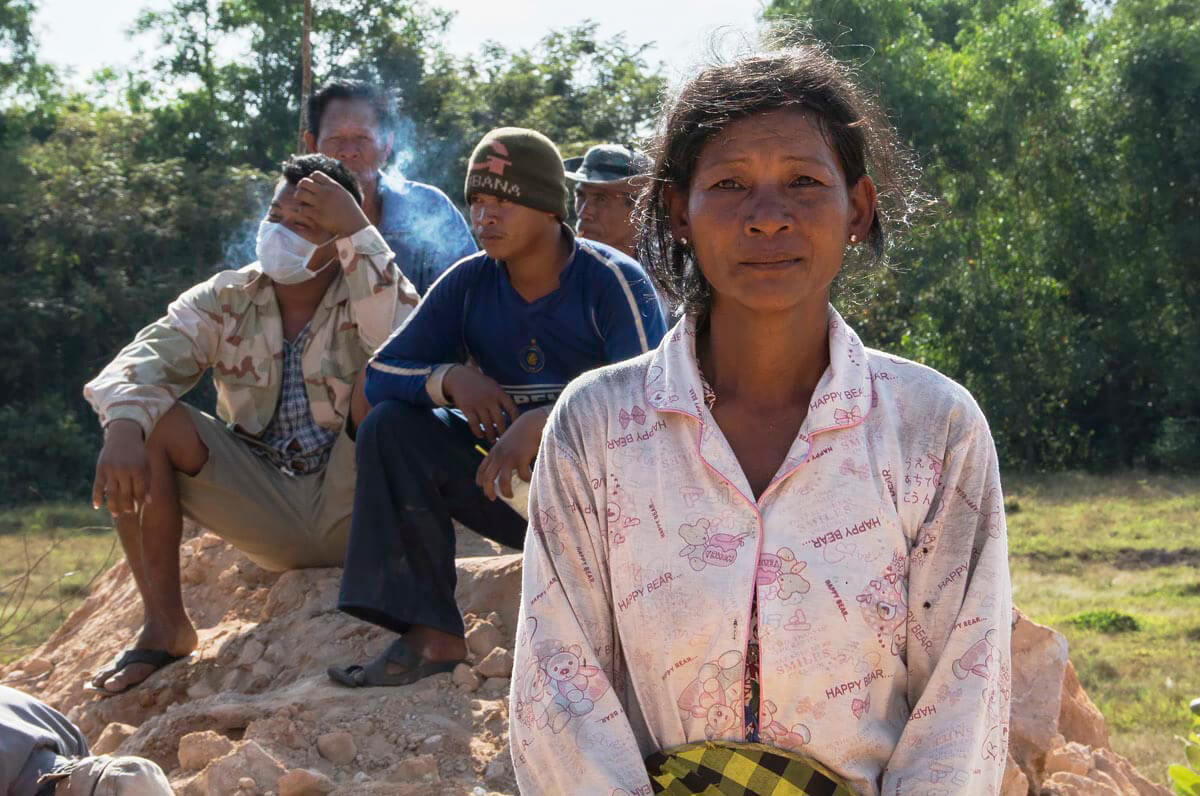 A woman made homeless by security guards, who burnt her house to make way for a Chinese casino, Cambodia<p>© Rod Harbinson</p>