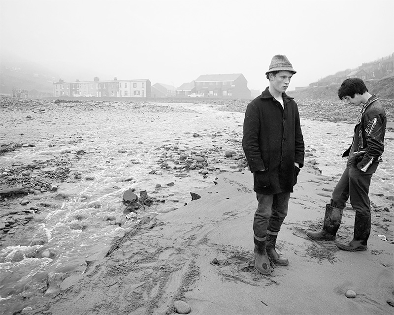 David and Whippet waiting for salmon 1983<p>© Chris Killip</p>