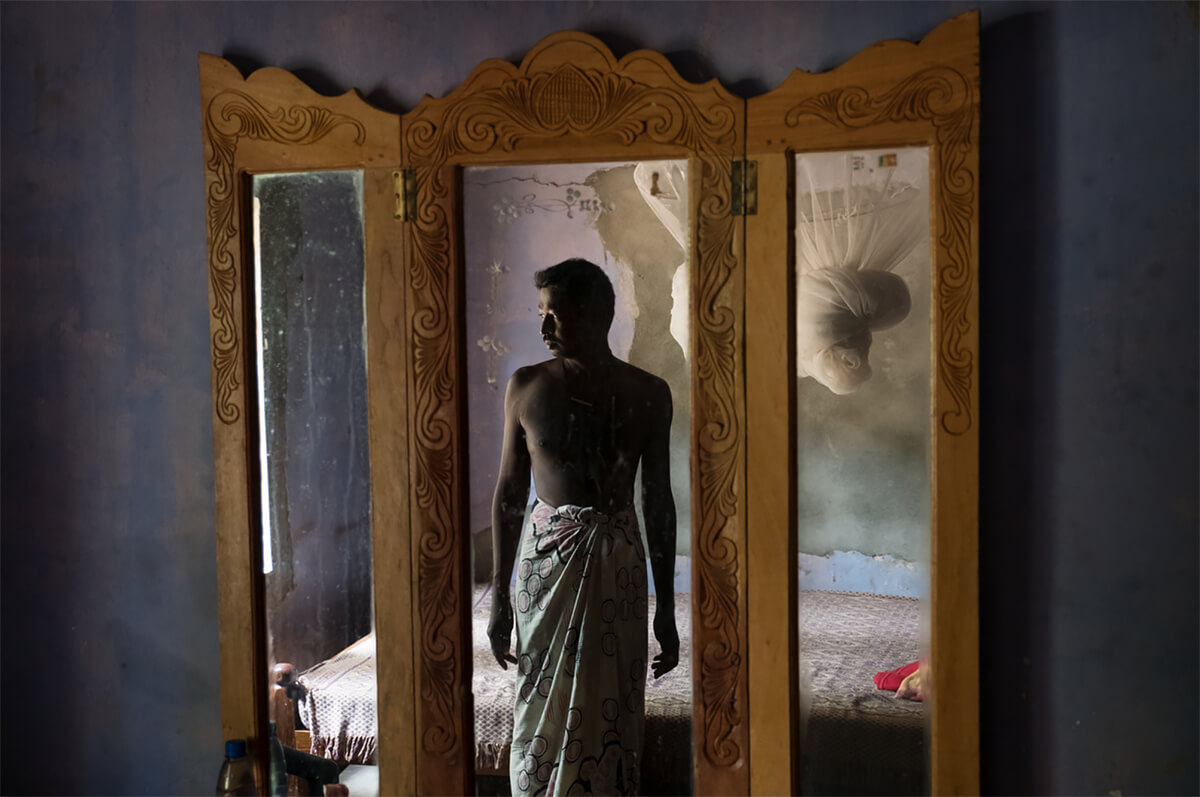 In the Hot Zone: CKDu in Sri Lanka. K. Bandulawarna, 37, poses for a portrait at home in Nelumvila Billewa, Sri Lanka. <p>Courtesy VII Photo Agency / © Ed Kashi</p>