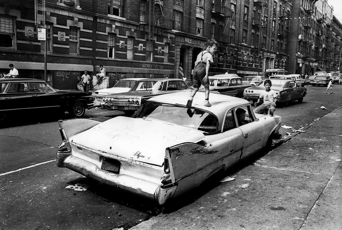 Photographer’s Paradise -  Black Ghetto Bronx kid walking on car<p>© Jean-Pierre Laffont</p>