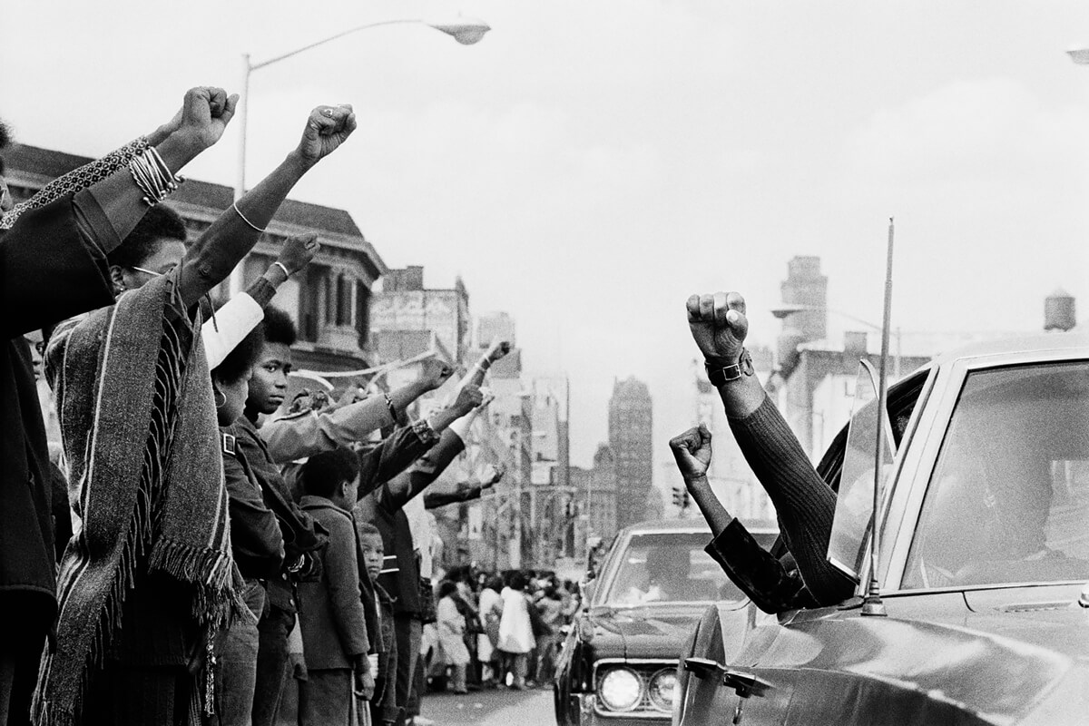 Photographer’s Paradise -  Attica Funerals, people holding the Black Panther salute<p>© Jean-Pierre Laffont</p>