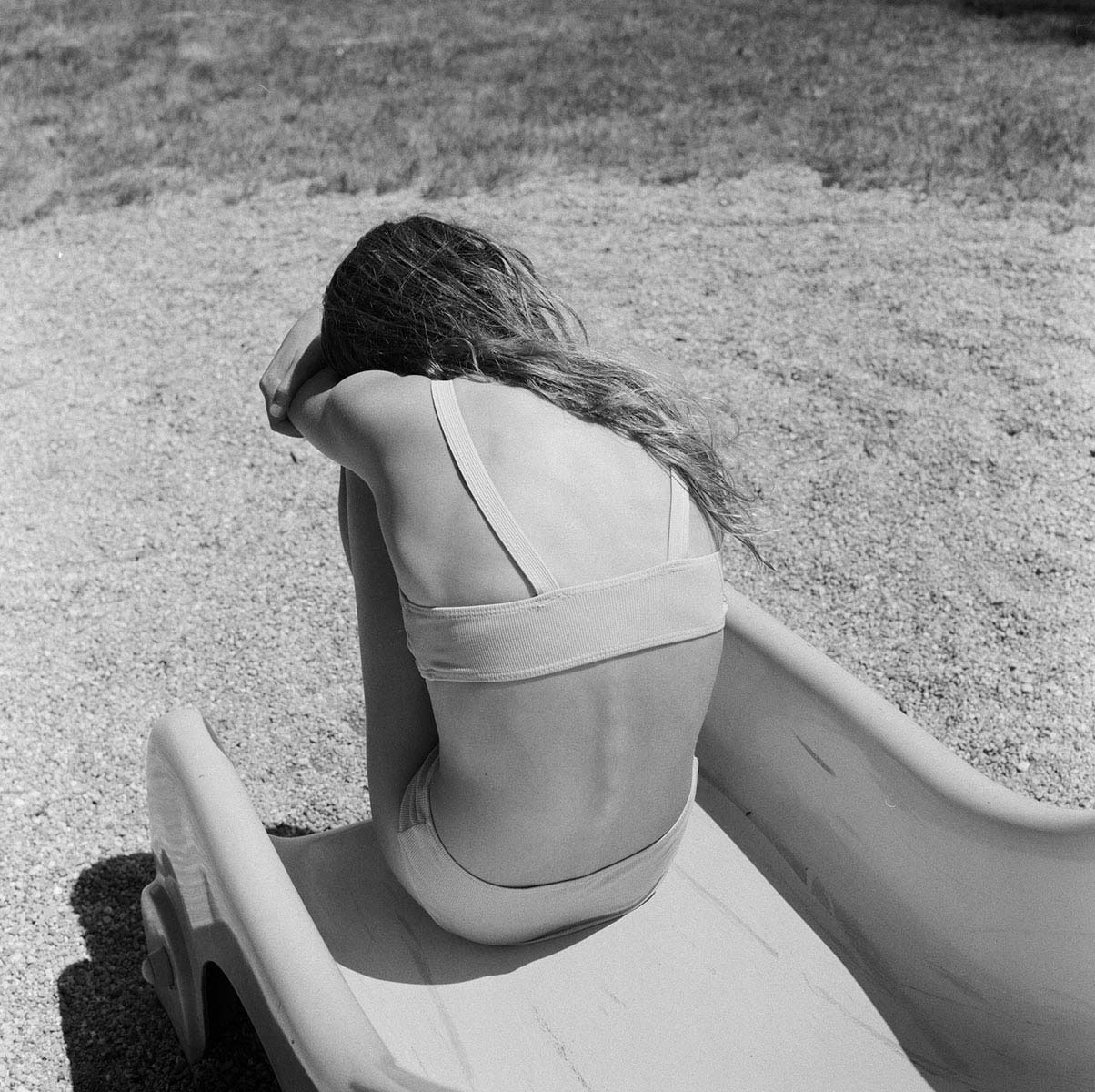 Girl on slide by the river bend - from RIVERLAND<p>© Marjolein Martinot</p>