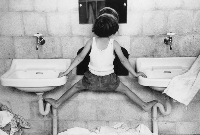 Tirza on sinks, Israel 1951<p>© Ruth Orkin</p>