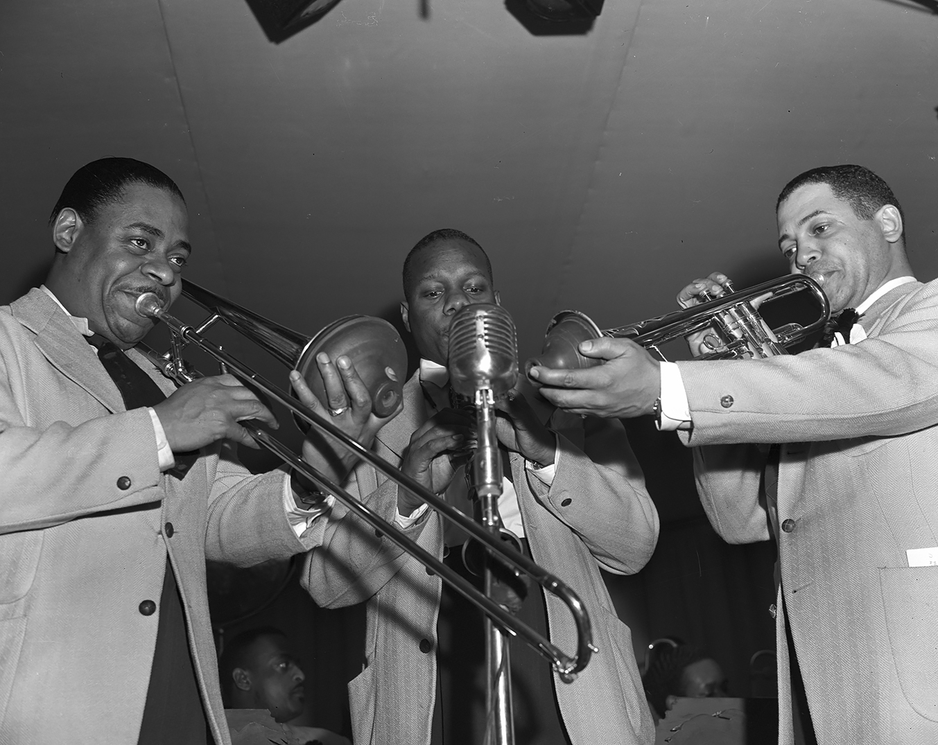 A trio of musicians from Duke Ellington’s orchestra during the early morning broadcast, New York 1943<p>© Gordon Parks</p>