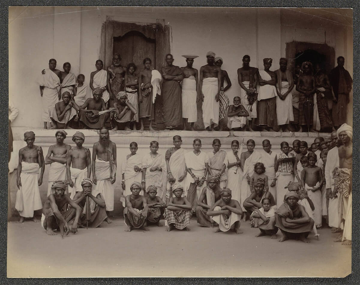 Men and women posing in front of a building, possibly in Ceylon, ca. 1875 - ca. 1880<p>© Charles Scowen</p>