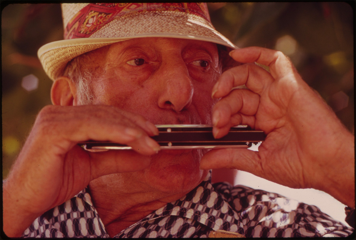 RESIDENT OF A RETIREMENT HOTEL IN SOUTH BEACH WITH HARMONICA, June 1973 - NARA<p>© Flip Schulke</p>