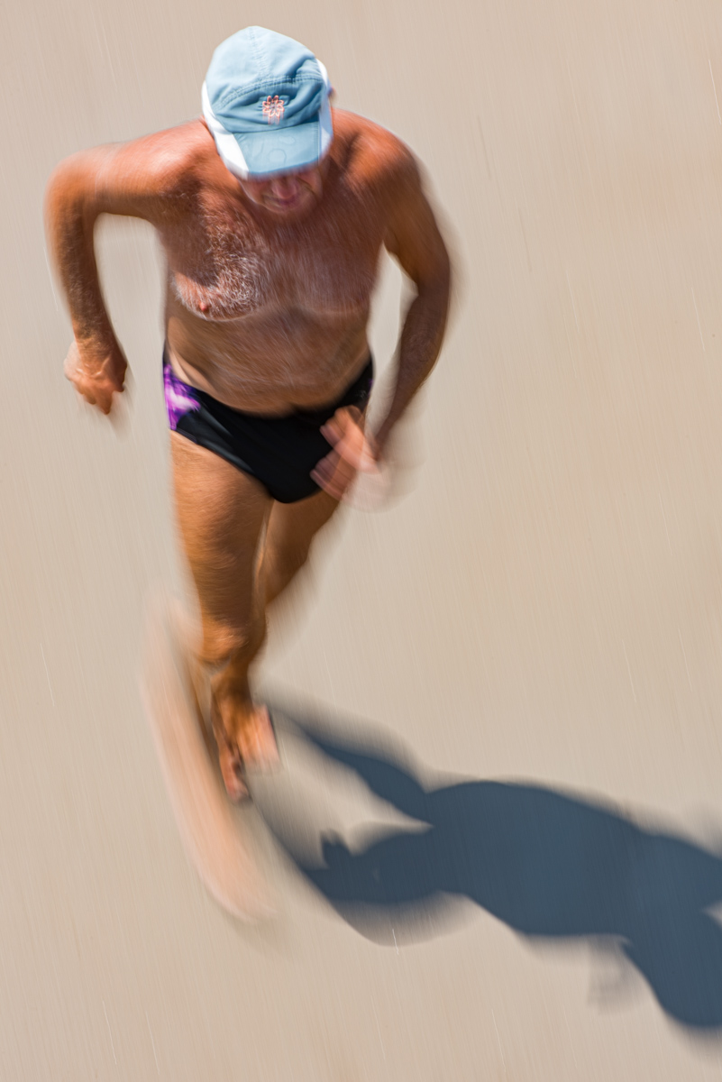 Man Running on Beach, Coney Island, NYC, 2019<p>© Gregory Spaid</p>