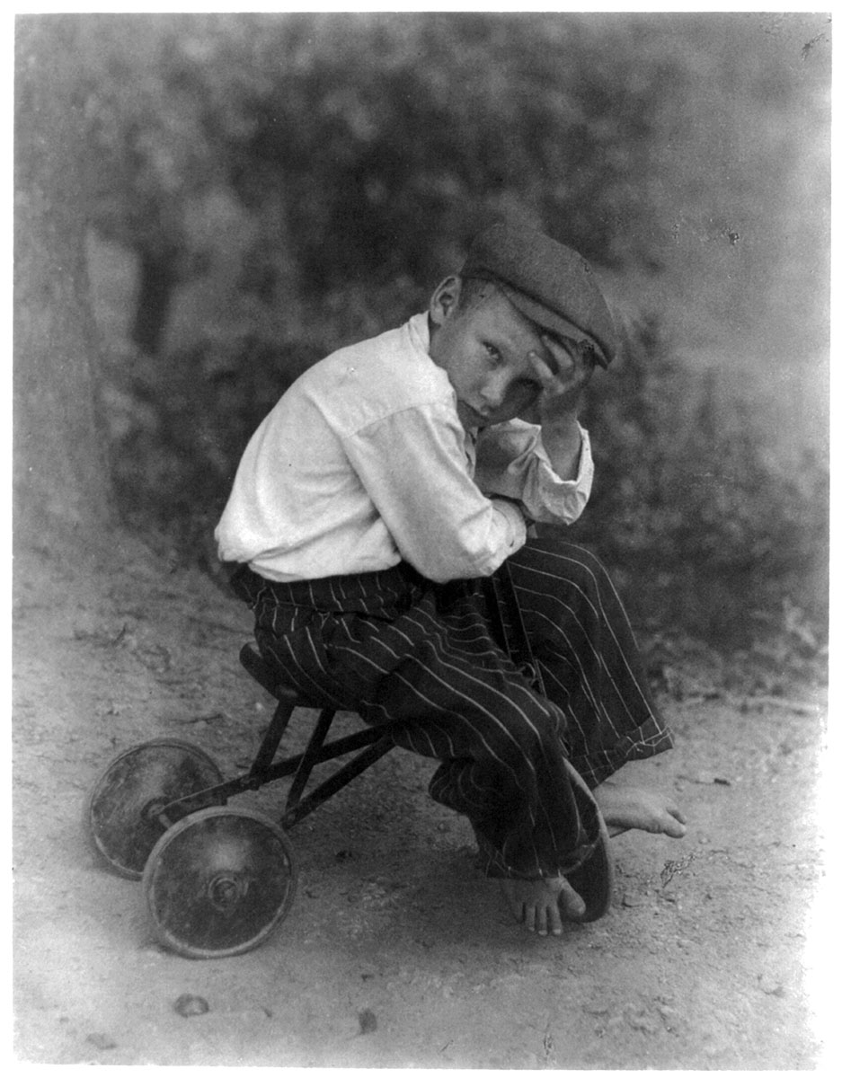 Small boy on ”kiddie car”, circa 1930<p>© Doris Ulmann</p>