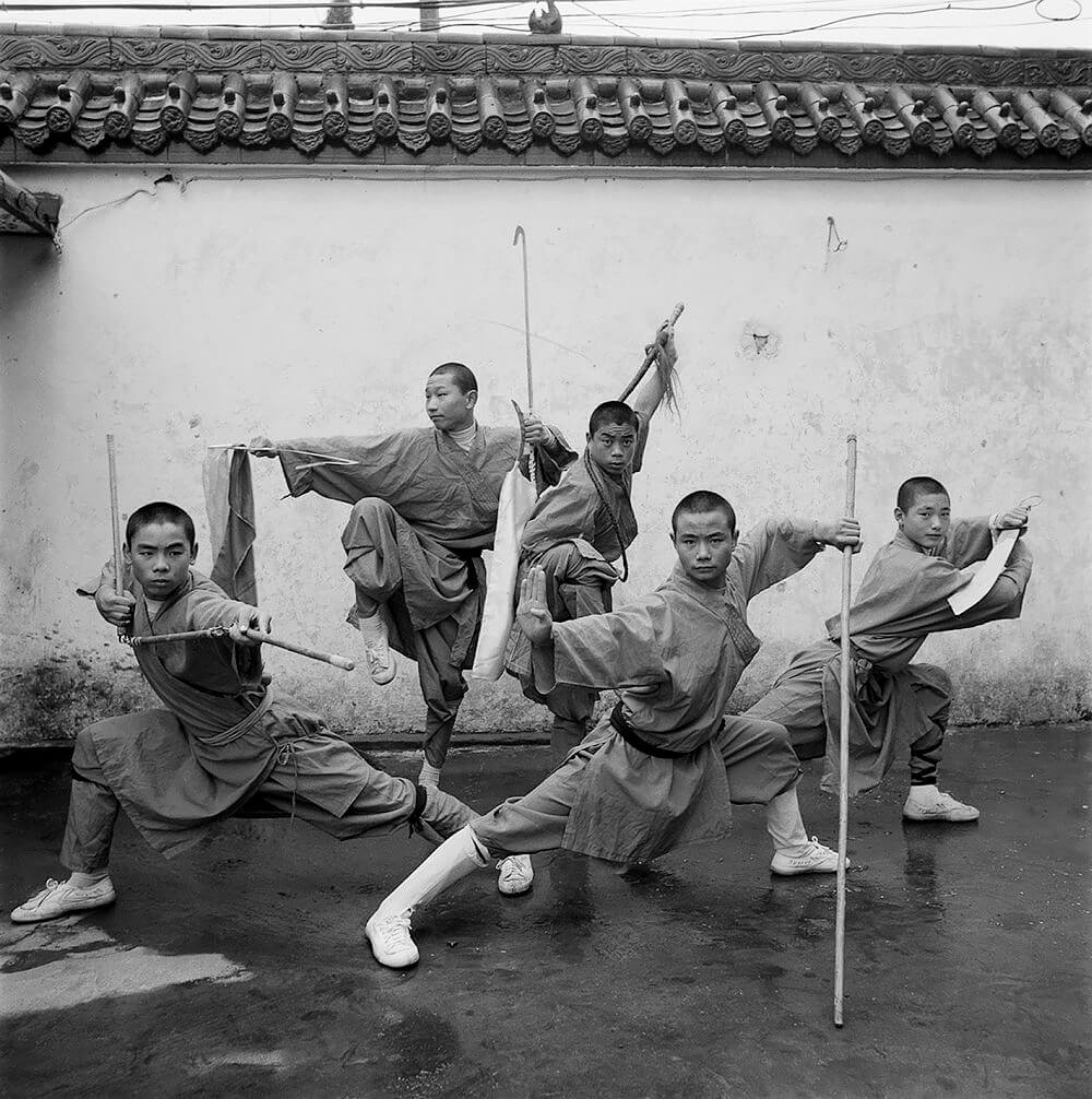 Buddhist Monks Play Martial Arts, Shaolin Monastery, Henan Province,2000<p>© Liu Zheng</p>