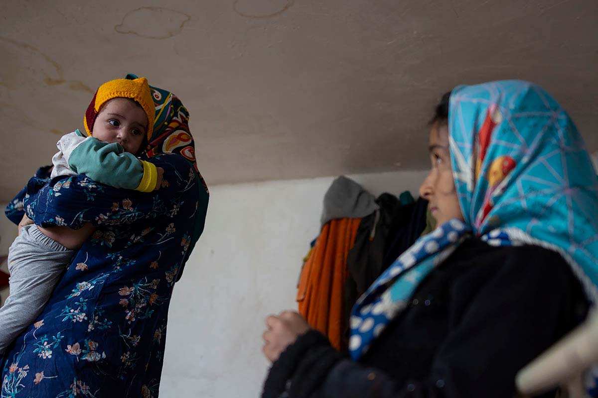 Kasra is in his mother’s arms. Sometimes Mahsa is jealous of her brother, especially when her mother hugs Kasra. Amir Ayyub, Iran, January 2021.<p>© Sajedeh Zarei</p>