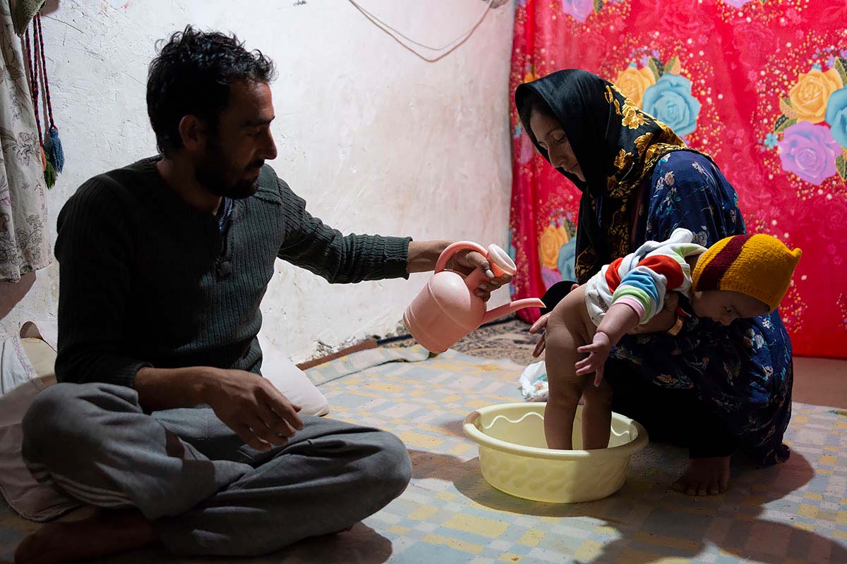 Asma and Mohsen are washing Kasra. Since Asma has decided to minimize this discrimination, he participates in the work. Amir Ayyub, Iran, January 2021<p>© Sajedeh Zarei</p>