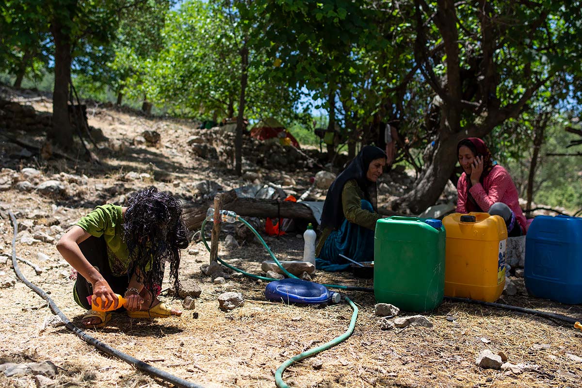 Mahsa is washing her hair. She says: I grew up and I have to do my own thing. Ab-Zardi, Fars Province, Iran, June 2020.<p>© Sajedeh Zarei</p>